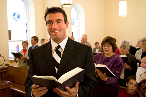 religious guy in suit at a church